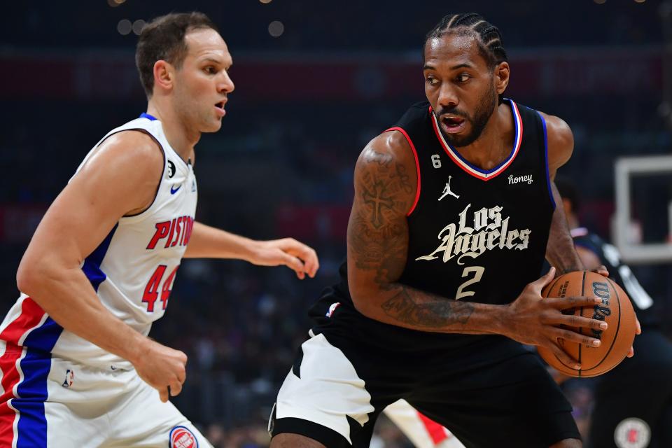 Los Angeles Clippers forward Kawhi Leonard (2) controls the ball against Detroit Pistons forward Bojan Bogdanovic (44) during the first half at Crypto.com Arena in Los Angeles on Thursday, Nov. 17, 2022.