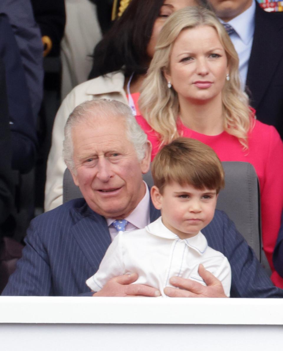 LONDON, ENGLAND - JUNE 05: Prince Louis of Cambridge sits on Prince Charles, Prince of Wales lap during the Platinum Pageant on June 05, 2022 in London, England. The Platinum Jubilee of Elizabeth II is being celebrated from June 2 to June 5, 2022, in the UK and Commonwealth to mark the 70th anniversary of the accession of Queen Elizabeth II on 6 February 1952. (Photo by Chris Jackson - WPA Pool/Getty Images)