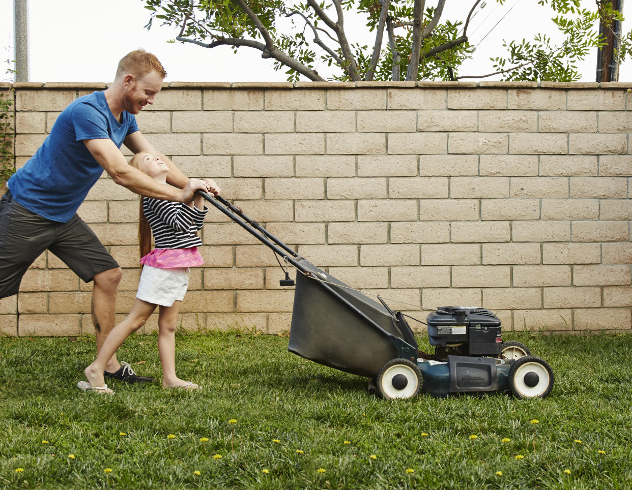 "Lawn mower parenting" is making headlines as more parents try to mow down every obstacle or difficulty their child may face. (Photo: Keith Berson via Getty Images)