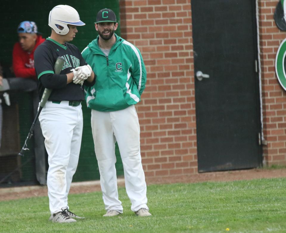 Clear Fork senor Kaleb Hollar and Colts' head coach Joe Staab enjoy a chat during a break in action during a sectional semifinal win over Mansfield Senior on Wednesday.