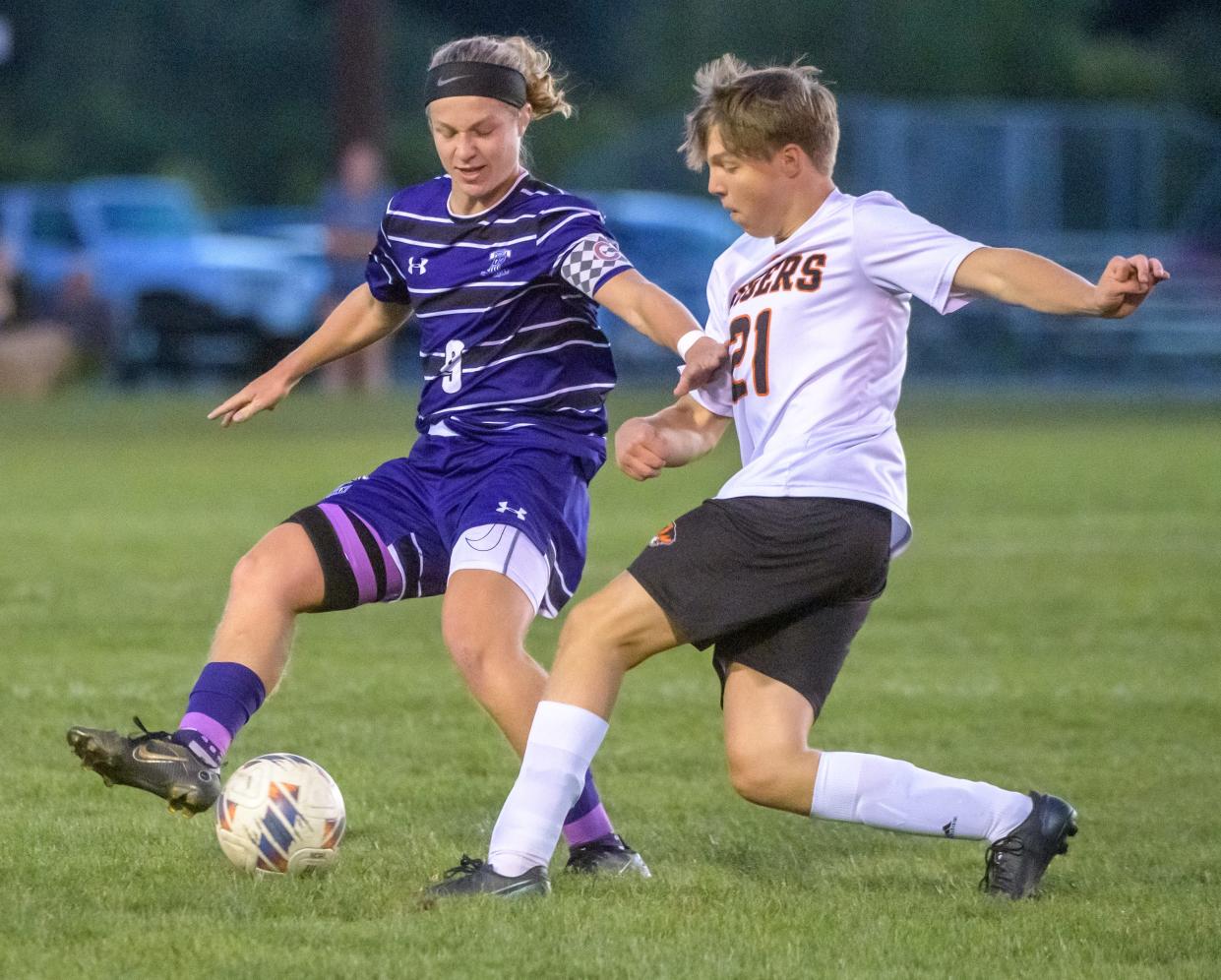 Peoria Christian's Quinton Hynek, left, and Illini Bluffs' Jackson Carroll battle for the ball in the first period of their varsity soccer match Tuesday, Sept. 27, 2022 at EastSide Center in East Peoria. Peoria Christian prevailed 7-0.