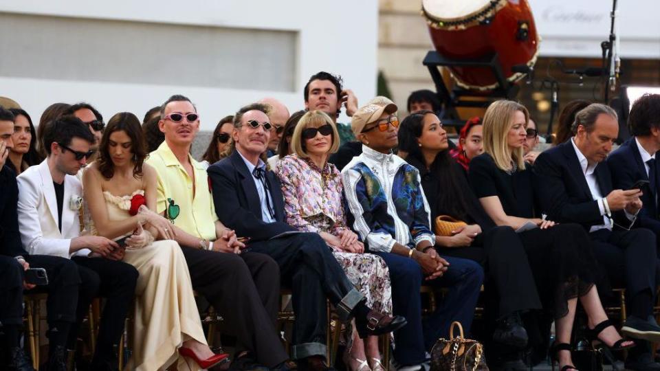 Vogue editor Anna Wintour watches on besides Louis Vuitton creative director Pharrell Williams 