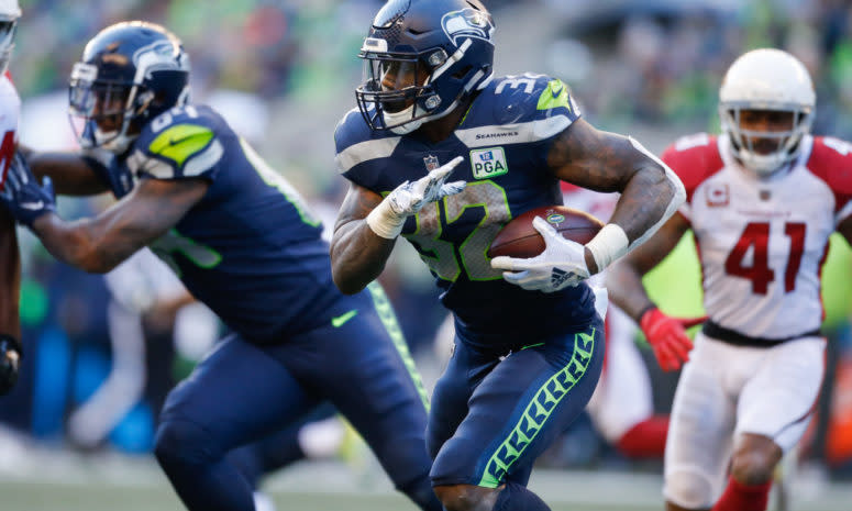 Chris Carson running the football for the Seattle Seahawks.