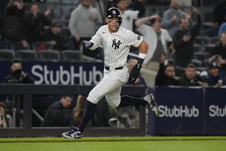 New York Yankees' Aaron Judge runs to home plate to score on a double by Giancarlo Stanton during the ninth inning of a baseball game against the Detroit Tigers, Friday, May 3, 2024, in New York. (AP Photo/Frank Franklin II)