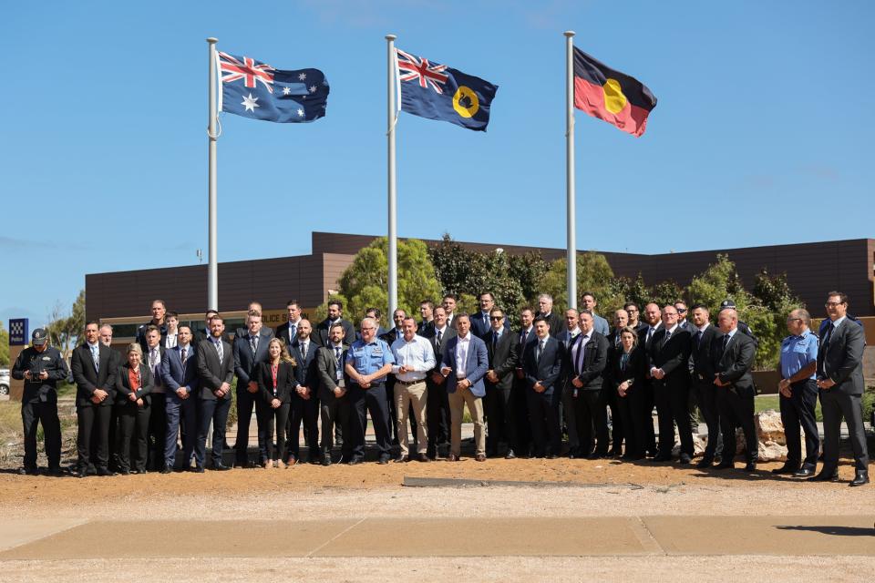 Western Australia Premiere Mark McGowan poses with police officers after speaking at a press conference in front of the Carnarvon Police Station (Getty)