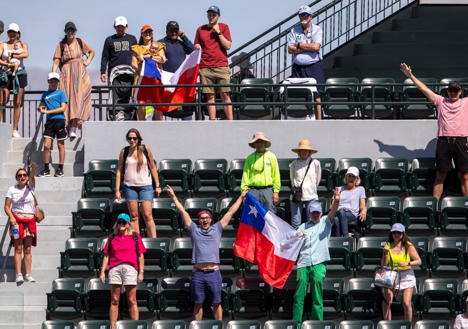 Fans cheer for Cristian Garin of Chile after he defeats Casper Ruud of Norway in their round three match at the BNP Paribas Open at the Indian Wells Tennis Garden in Indian Wells, Calif., Sunday, March 12, 2023. 