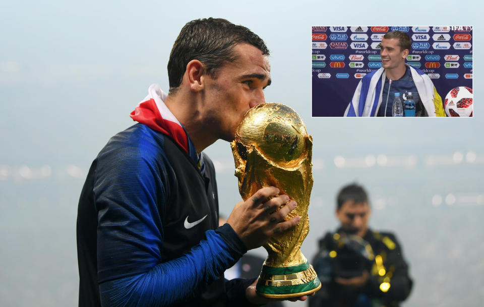 Antoine Griezmann of France kisses the World Cup trophy. (Photo by Shaun Botterill/Getty Images)