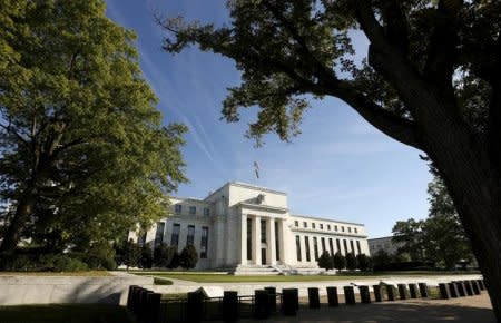 FILE PHOTO: The Federal Reserve headquarters in Washington September 16 2015. The Federal Reserve, facing this week its biggest policy decision yet under Chair Janet Yellen, puts its credibility on the line regardless of whether it waits or raises interest rates for the first time in nearly a decade.       REUTERS/Kevin Lamarque/File Photo