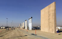 <p>People look at prototypes of a border wall Thursday, Oct. 26, 2017, in San Diego. (Photo: Elliott Spagat/AP) </p>