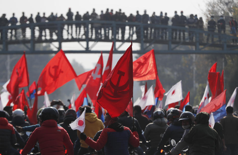 Nepalese supporters of the splinter group in the governing Nepal Communist Party participate in a protest in Kathmandu, Nepal, Tuesday, Dec. 29, 2020. Tens of thousands of supporters of the splinter group rallied in the capital on Tuesday demanding the ouster of the prime minister and the reinstatement of the Parliament he dissolved amid an escalating feud in the party. (AP Photo/Niranjan Shrestha)