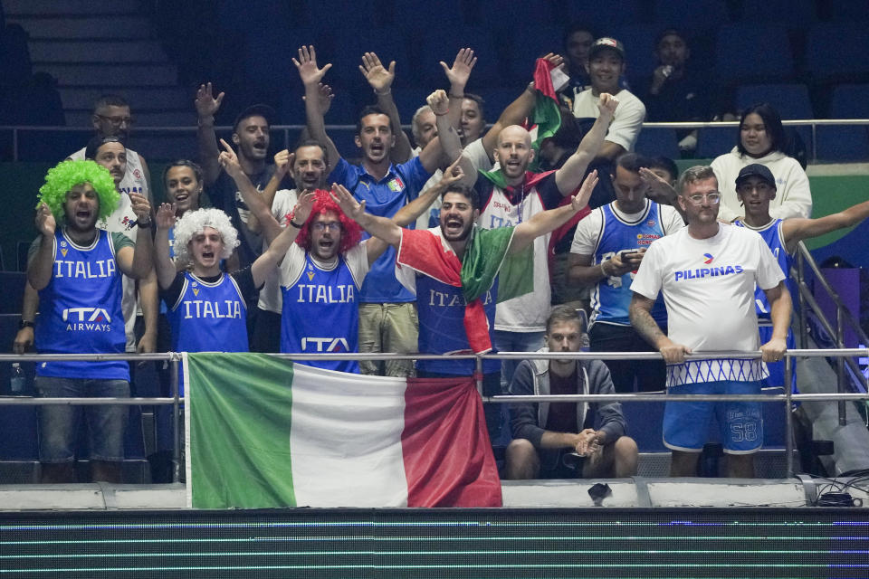 Italy supporters cheer during their Basketball World Cup second round match against Puerto Rico at the Araneta Coliseum, Manila, Philippines on Sunday Sept. 3, 2023. (AP Photo/Aaron Favila)