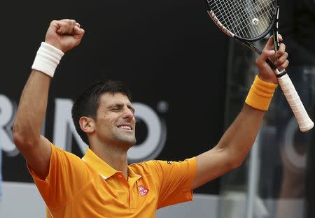 Novak Djokovic of Serbia celebrates after winning his semi-final match against David Ferrer of Spain at the Rome Open tennis tournament in Rome, Italy, May 16, 2015. REUTERS/Stefano Rellandini