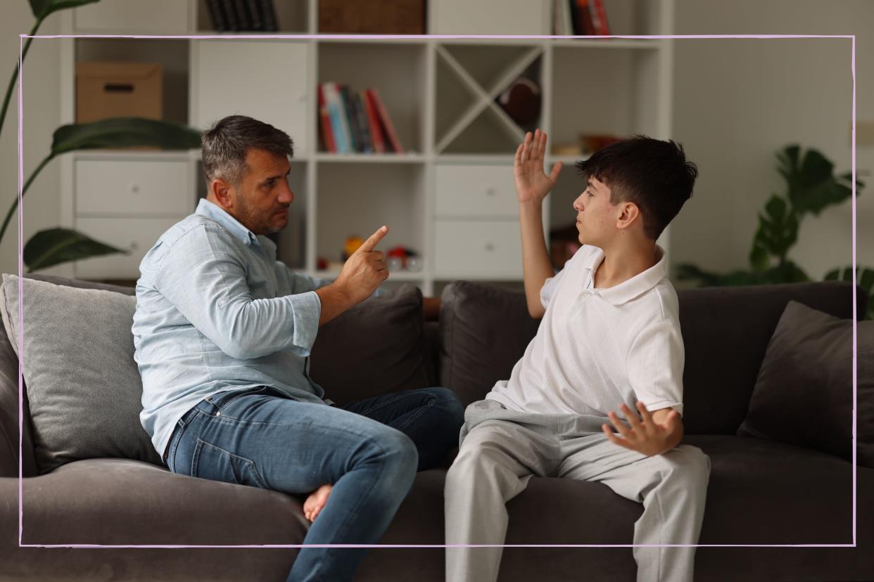  Dad having an argument with his teenage son. 