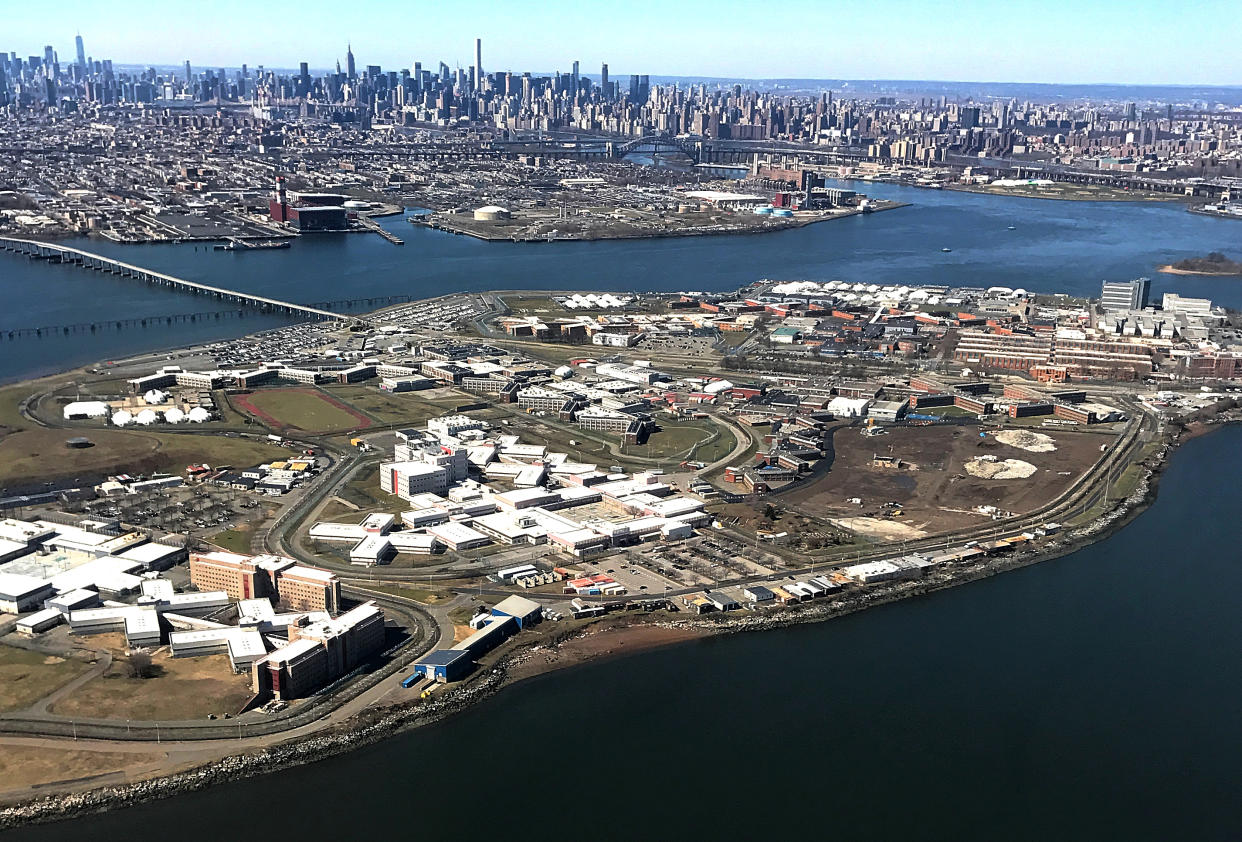 The low-lying complex of Rikers Island with the New York skyline in the background.