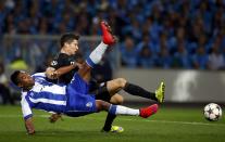 Bayern Munich's Robert Lewandowski (R) and Porto's Alex Sandro fight for the ball during their Champions League quarterfinal first leg soccer match at Dragao stadium in Porto April 15, 2015. REUTERS/Rafael Marchante TPX IMAGES OF THE DAY