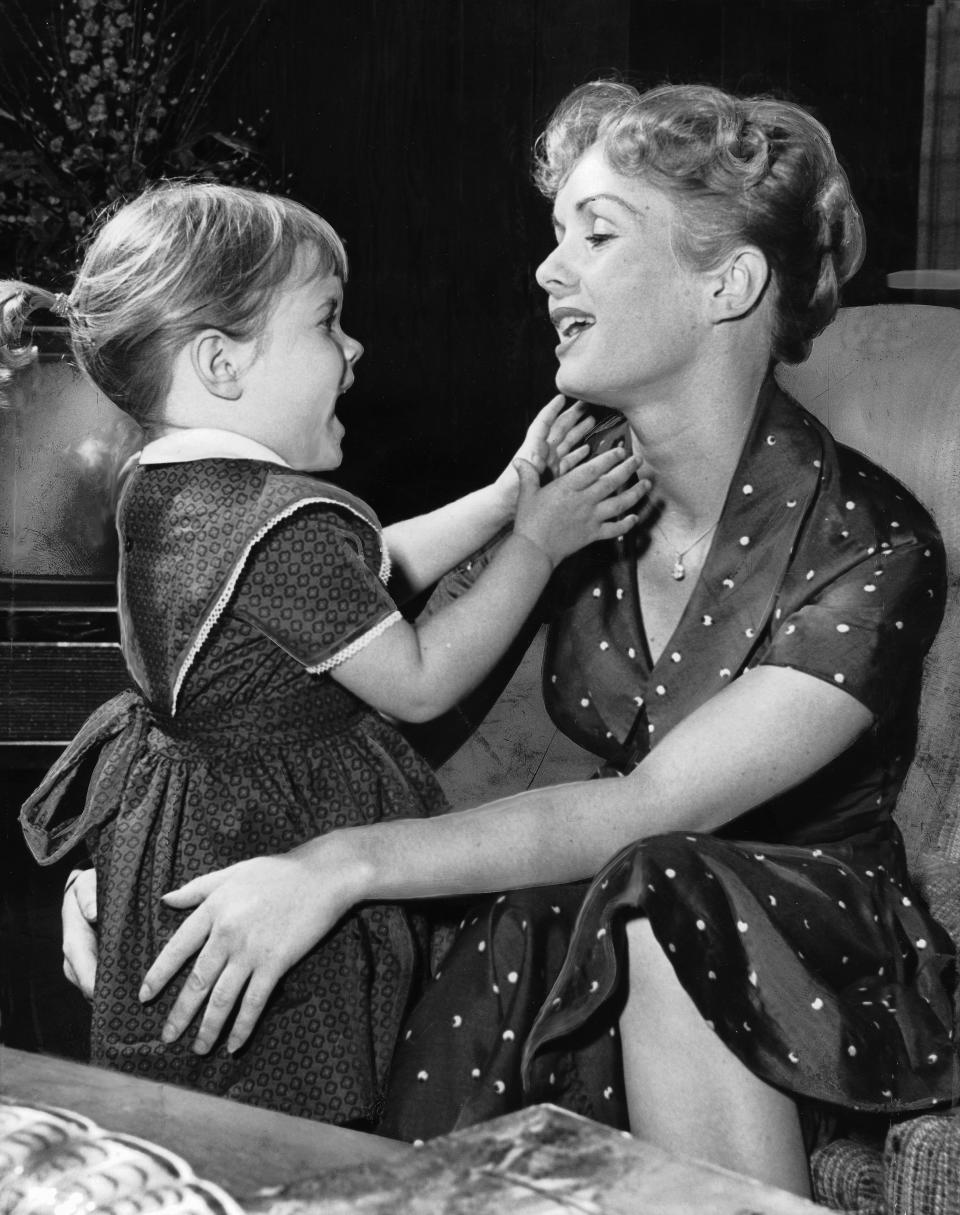 Debbie Reynolds with 3-year-old Carrie at home on&nbsp;November 16, 1959, in Los Angeles.