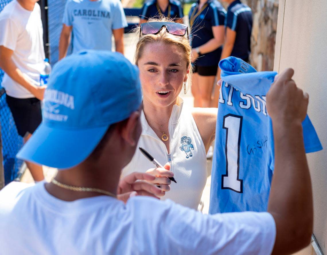 North Carolina field hockey coach Erin Matson autographs one of her jersey’s for a fan after the Tar Heels’ loss to Iowa on Sunday, August 27, 2023 at Karen Shelton Stadium in Chapel Hill, N.C.