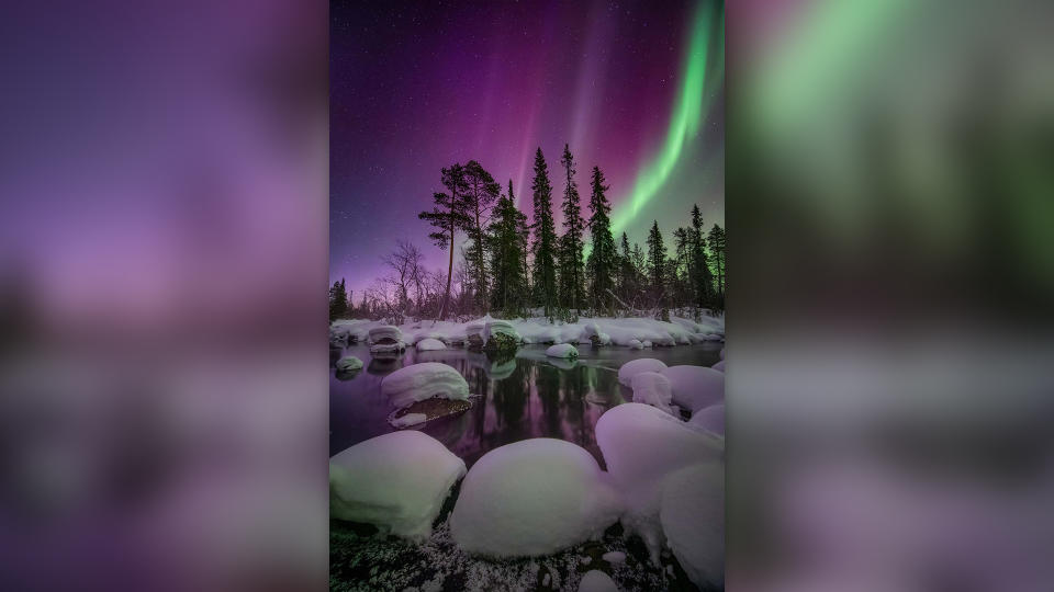 Purple and green northern lights over Kola Peninsula, Russia.