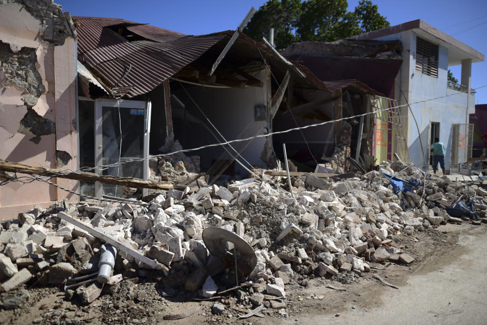 Homes are damaged after an earthquake struck Guanica, Puerto Rico, Tuesday, Jan. 7, 2020. A 6.4-magnitude earthquake struck Puerto Rico before dawn on Tuesday, killing one man, injuring others and collapsing buildings in the southern part of the island. (AP Photo/Carlos Giusti)