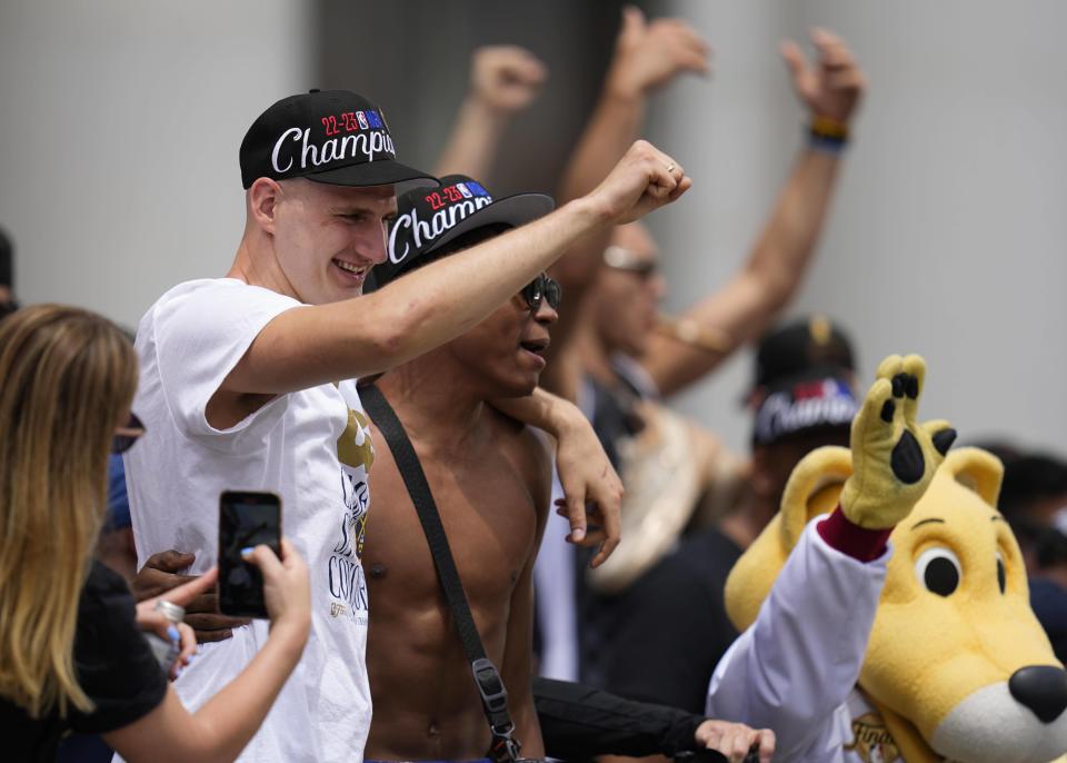 Denver Nuggets center Nikola Jokic gestures during a rally to celebrate the Denver Nuggets first NBA basketball championship Thursday, June 15, 2023, in Denver. (AP Photo/Jack Dempsey)