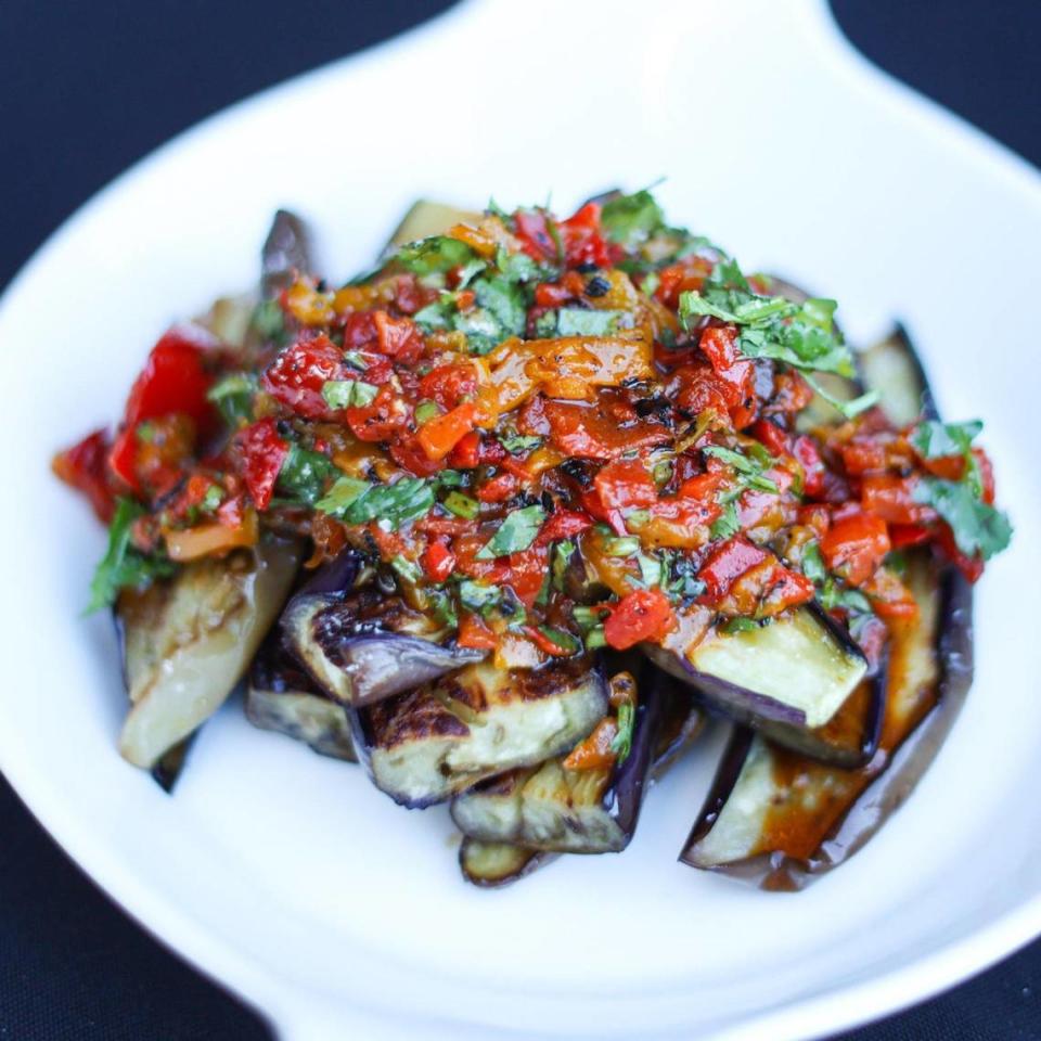 Steamed eggplant from Surfside Farm in Morro Bay is topped with Sichuan-roasted pepper tapenade. Garrett Morris of Sichuan Kitchen SLO hosted a pop up dinner at Hotel San Luis Obispo’s High Bar on Oct. 17, 2023.