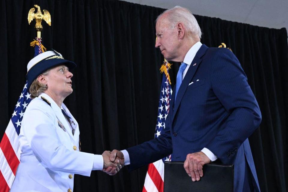 Admiral Linda Fagan greets President Joe Biden during the U.S. Coast Guard change of command ceremony at USCG Headquarters in Washington, D.C., on June 1, 2022.  / Credit: SAUL LOEB/AFP via Getty Images