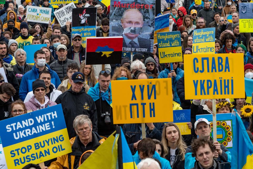 FTSEMarchers wave signs and repeat chants as they circle the Parkman Bandstand during a rally for peace in the Ukraine  in Boston, Massachusetts on March 6, 2022. - Marchers chanted stop the war, ban Russian oil, Ukraine is not Russia, and close the sky, as well as many other chants as they marched to Boston Common. (Photo by Joseph Prezioso / AFP) (Photo by JOSEPH PREZIOSO/AFP via Getty Images)