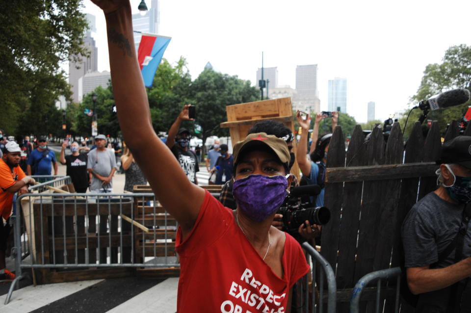 Housing activists and residents raise their fists in solidarity with each other and all unhoused people struggling each day to survive on the street or in an inadequate and ineffective shelter system that perpetuates homelessness and instability in Philadelphia, PA, on September 9, 2020. (Photo by Cory Clark/NurPhoto via Getty Images)