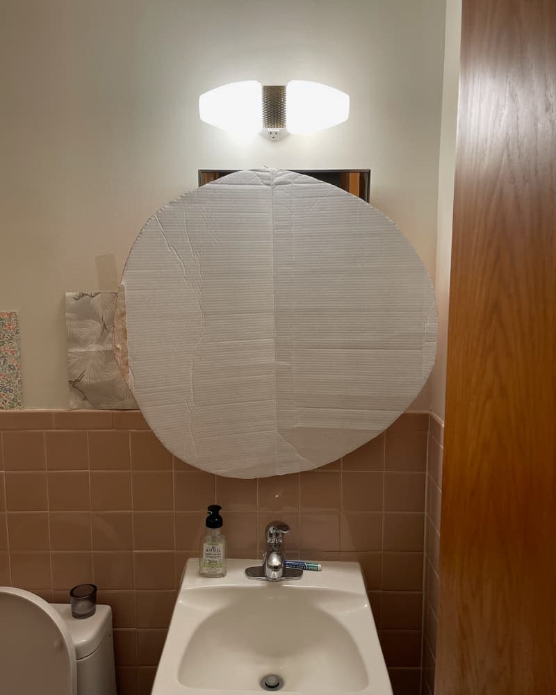 Vanity area of bathroom before renovation.