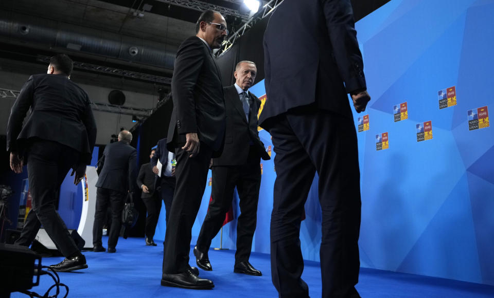 Turkish President Recep Tayyip Erdogan, second right, leaves the podium after addressing a media conference at a NATO summit in Madrid, Spain on Thursday, June 30, 2022. North Atlantic Treaty Organization heads of state met for the final day of a NATO summit in Madrid on Thursday. (AP Photo/Manu Fernandez)