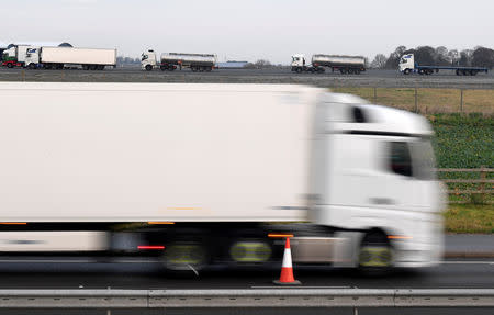 Lorries wait to leave disused Manston Airport to attend a test drive to the Port of Dover during a trial of how road will cope in case of a "no-deal" Brexit, Kent, Britain January 7, 2019. REUTERS/Toby Melville