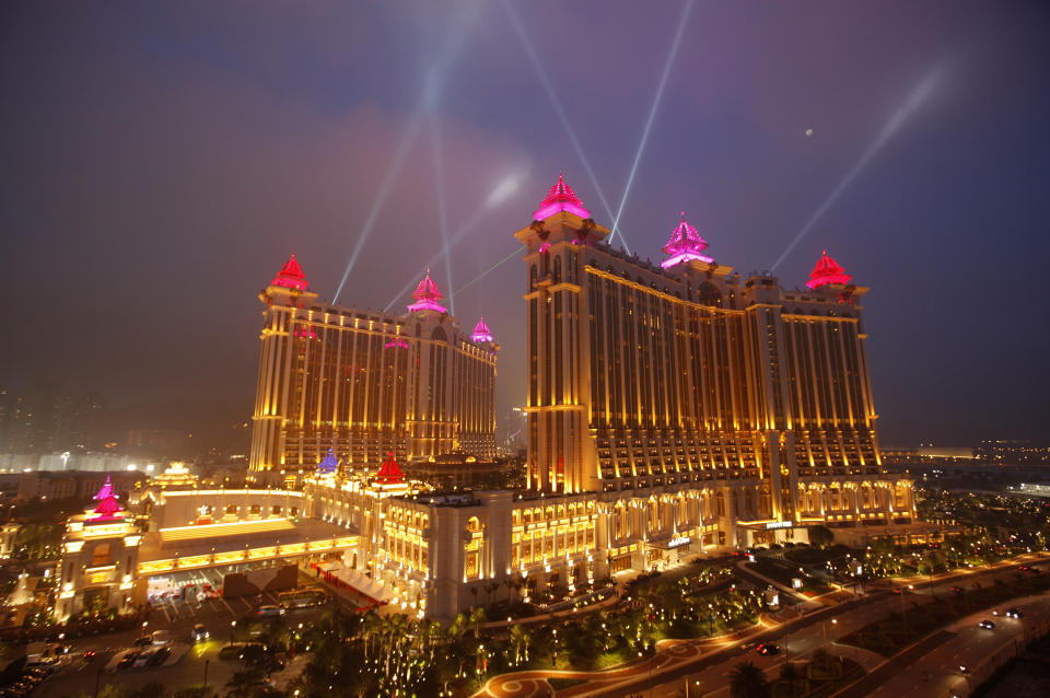 FILE - In this May 15, 2011 file photo, the complex of Galaxy Macau is illuminated in Macau. In the Philippines, a $4-billion casino project will soon rise from reclaimed land on Manila Bay. In South Korea, foreign investors are scheduled to break ground next year on a clutch of casino resorts offshore. The projects are part of a casino building boom rolling across Asia, where governments are trying to develop their tourism markets to capture increasingly affluent Asians with a penchant for gambling. (AP Photo/Vincent Yu, File)