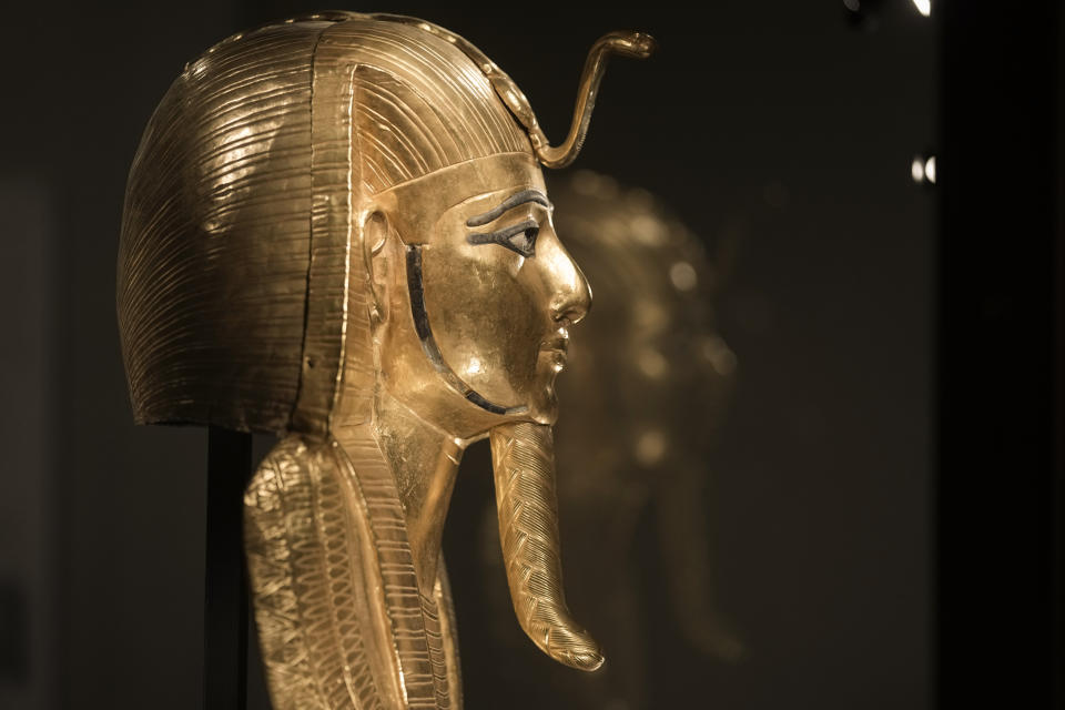 A recently golden funerary mask of king Psusennes I, is displayed at the Egyptian museum in Cairo, Egypt, Monday, Feb. 20, 2023. Egypt's ministry of tourism and antiquities unveiled a renovated wing within its 120-year-old museum, the first stage of a broader replenishment program for the palatial building. (AP Photo/Amr Nabil)