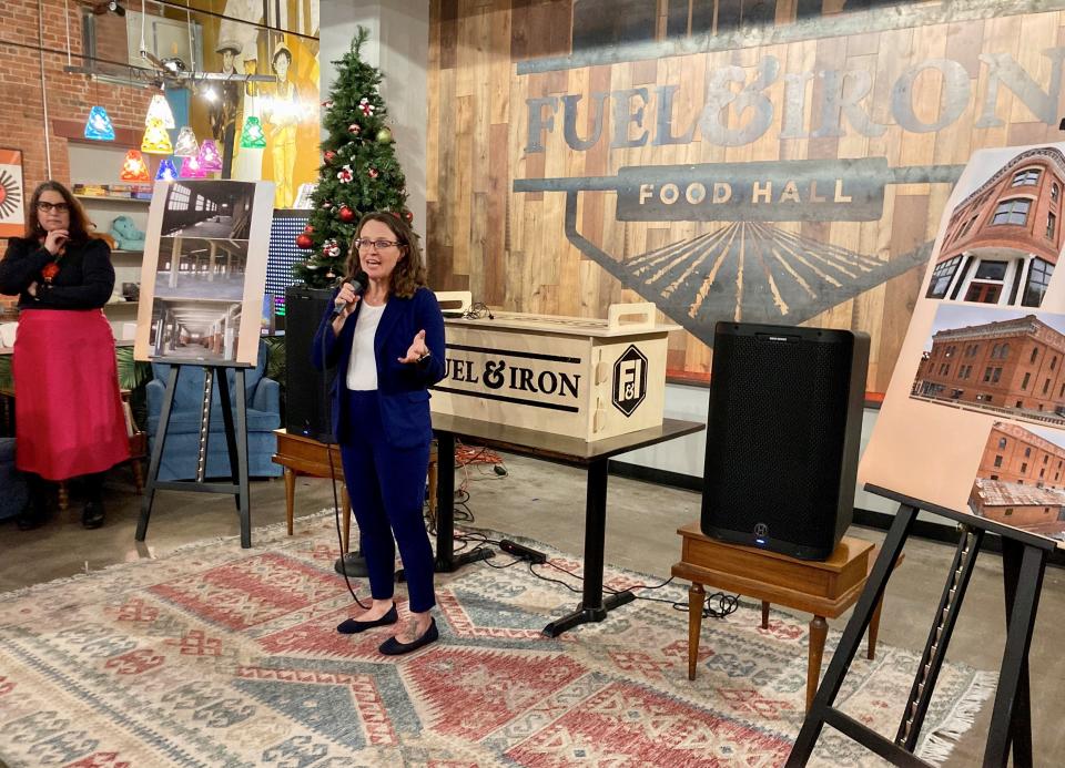 Pueblo County Commissioner Daneya Esgar speaks at Fuel & Iron Food Hall in downtown Pueblo on Dec. 12, 2023, as Dawn DiPrince, the president and CEO of History Colorado, listens.