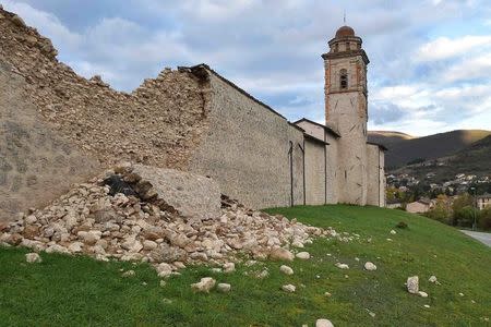 A damaged wall along a church is seen in Norcia, central Italy, October 27, 2016. REUTERS/Emiliano Grillotti