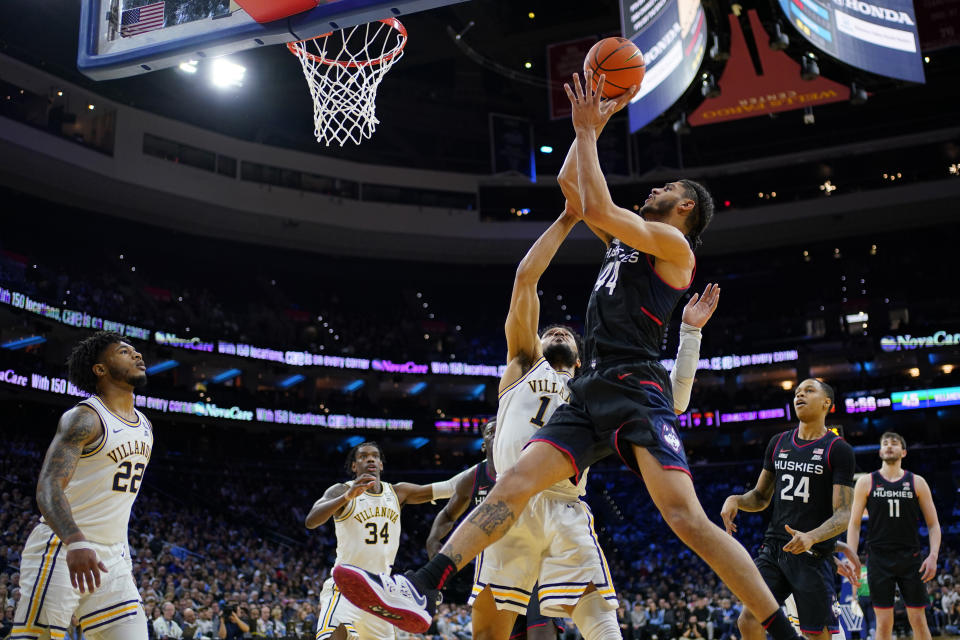 UConn's Andre Jackson Jr. (44) goes up for a shot against Villanova's Caleb Daniels (14) during the second half of an NCAA college basketball game, Saturday, March 4, 2023, in Philadelphia. (AP Photo/Matt Slocum)