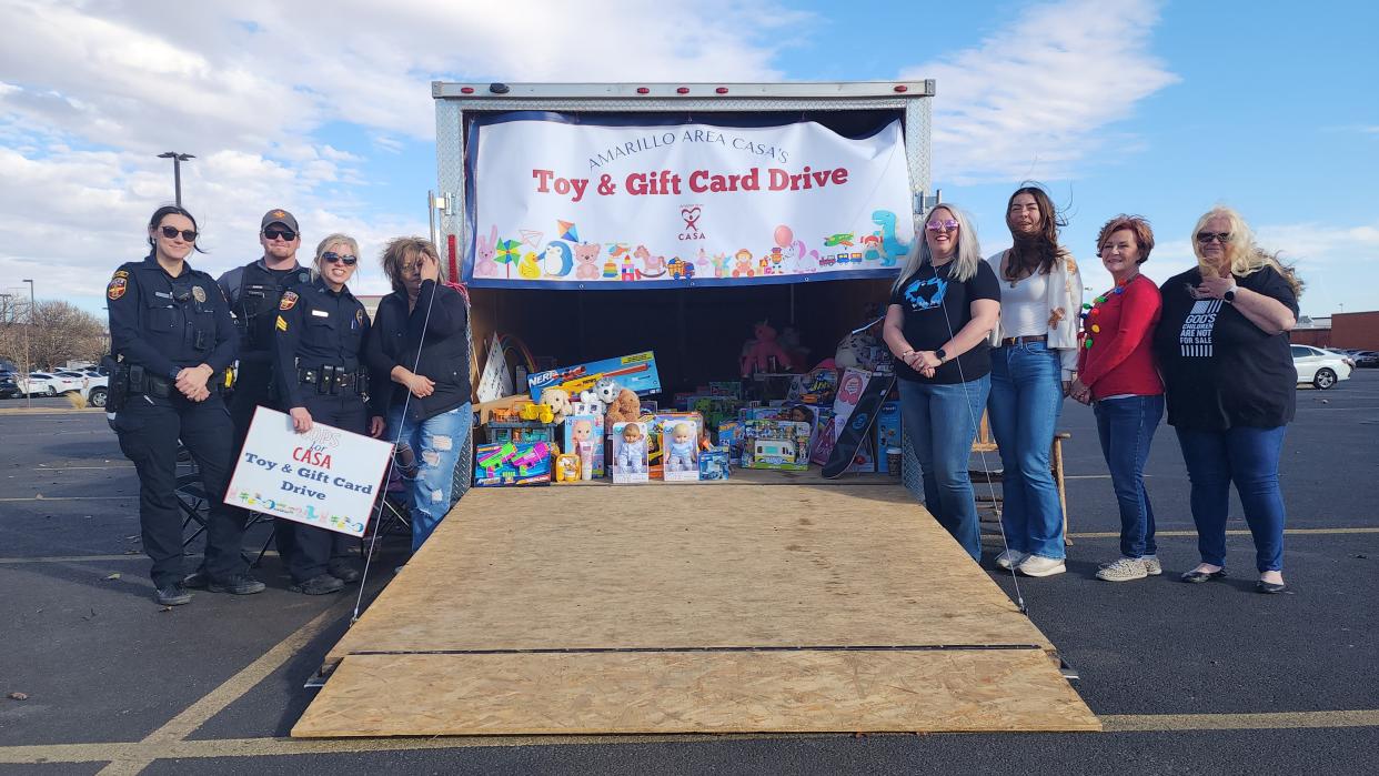 Amarillo's finest team up to ensure that children in the Amarillo area CSA have a merry Christmas at its cops for CASA Toy and Gift Card drive recently in the parking lot of Northern Tool in Amarillo.