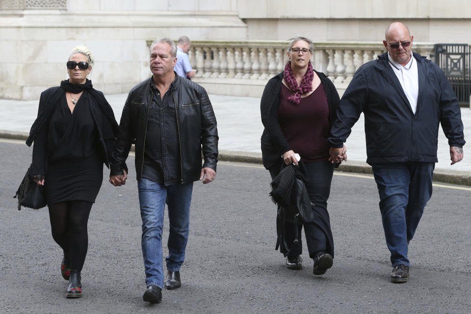 The family Harry Dunn, mother Charlotte Charles, left, and father Tim Dunn, right, arrive with their partners at the Foreign and Commonwealth Office in London, where they are meeting British Foreign Secretary Dominic Raab, Wednesday Oct. 9, 2019.  19-year old Harry Dunn was killed in a road accident Aug. 27, involving an American diplomat's wife who left the country under Diplomatic Immunity after reportedly becoming a suspect in the fatal crash. (Jonathan Brady/PA via AP)