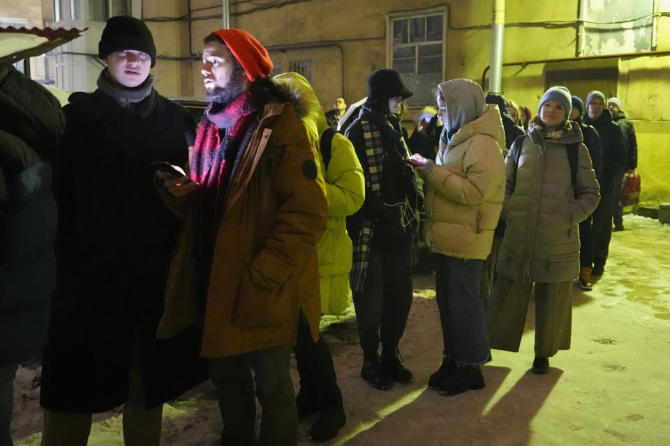 People line up to sign petitions in St. Petersburg, Russia, on Tueday, jan. 23, 2024, for the candidacy of Boris Nadezhdin, a liberal Russian politician who is seeking to run in the March 17 presidential election. Supporters lined up not just in progressive cities like Moscow and St. Petersburg but also in Krasnodar in the south, Saratov and Voronezh in the southwest and beyond the Ural Mountains in Yekaterinburg. There also were queues in the Far East city of Yakutsk, 450 kilometers (280 miles) south of the Arctic Circle, where Nadezhdin's team said up to 400 people a day braved temperatures that plunged to about minus 40 Celsius (minus 40 Fahrenheit) to sign petitions. (AP Photo/Dmitri Lovetsky)