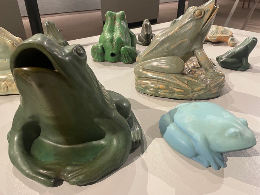 Ceramic frogs in the exhibit.