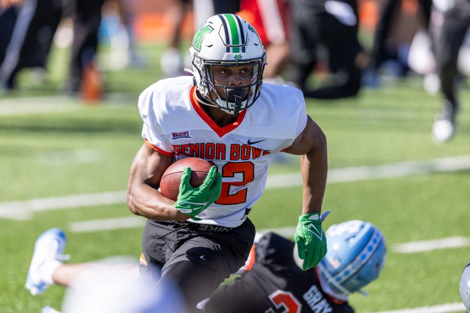 Jan 30, 2024; Mobile, AL, USA; National running back Rasheen Ali of Marshall (22) runs the ball during practice for the National team at Hancock Whitney Stadium. Mandatory Credit: Vasha Hunt-USA TODAY Sports