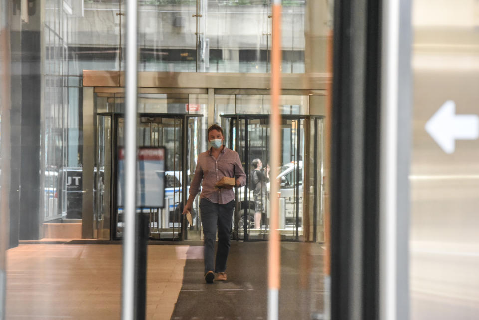 NEW YORK, NY - JUNE 22: A person walks through an office building lobby on June 22, 2020 in the Midtown neighborhood in New York City. New York City enters phase 2 reopening with the reopening of retails stores, outdoor dining, playgrouynds and barbershops. The city estimates as many as 400,000 people will return to work next month as coronavirus restrictions are lifted. (Photo by Stephanie Keith/Getty Images)