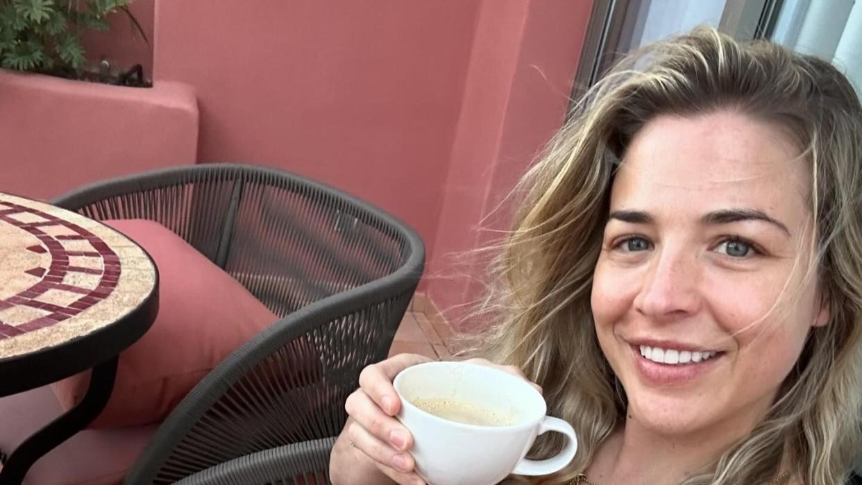 woman sipping coffee in black bikini 