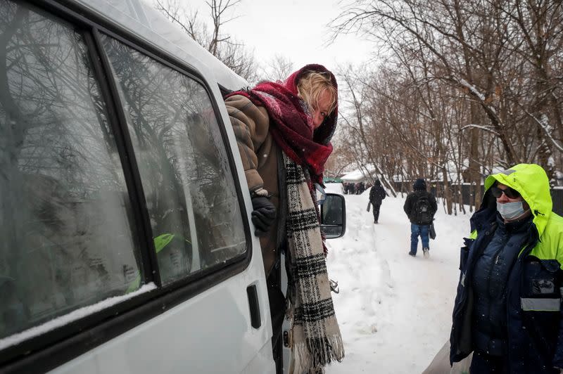 A homeless woman arrives at a centre for social adaptation in Moscow