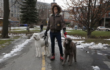 Andrea Constand, who accuses Bill Cosby of sexually assaulting her, walks her dogs in Toronto, Canada December 30, 2015. REUTERS/Mark Blinch