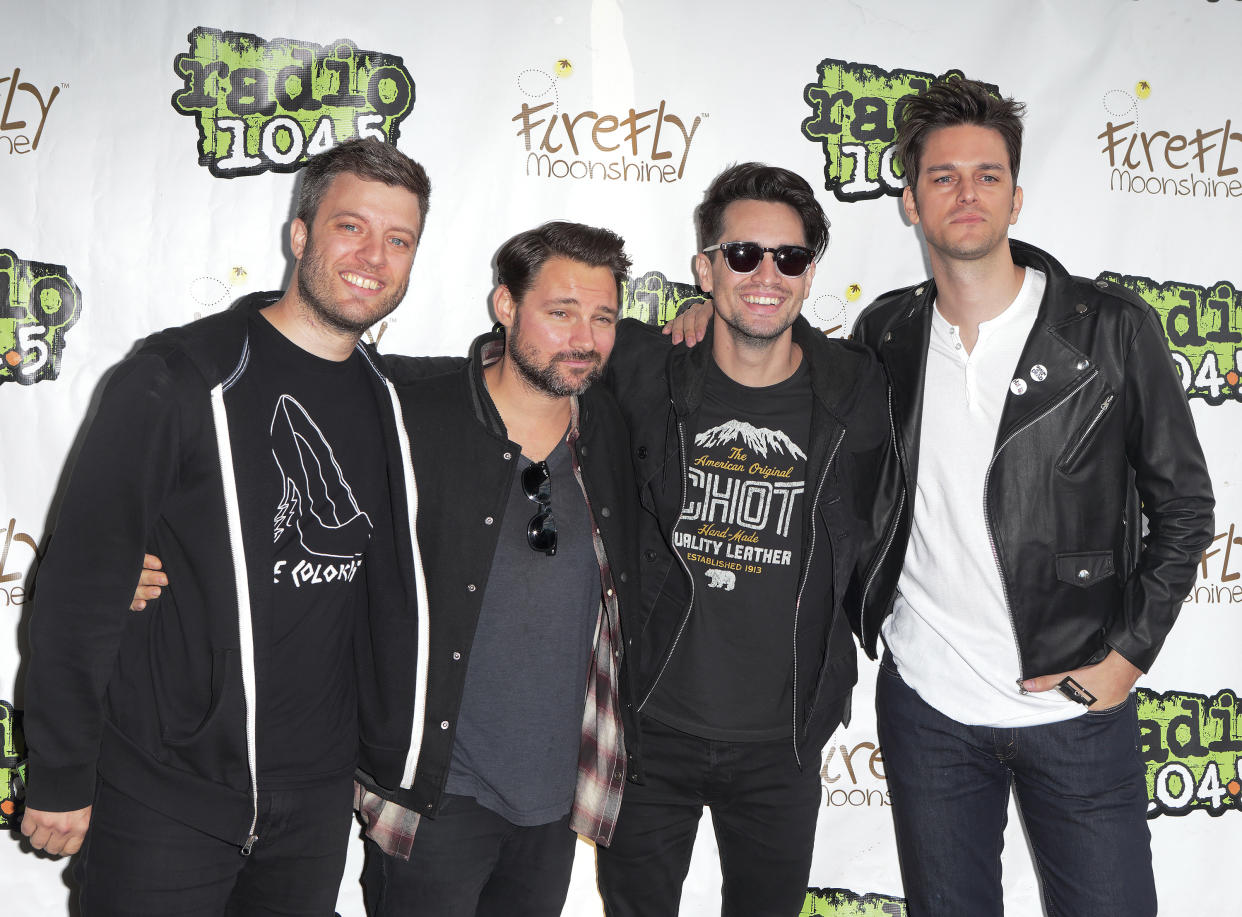 FILE - Dan Pawlovich, from left, Kenneth Harris, Brendon Urie and Dallon Weekes of the band Panic! at the Disco appear during the Radio 104.5 Summer Block Party in Philadelphia on Sept. 13, 2015. Urie, the only musician left from the original group, announced on the band’s Instagram page Tuesday that Panic! at the Disco “will be no more.” Urie shared that he and his wife, Sarah, are expecting a baby and that he plans to focus on his family. (Photo by Owen Sweeney/Invision/AP, File)