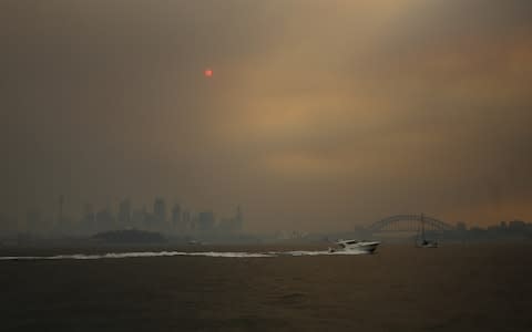 Smoke haze from bushfires in New South Wales engulfs Sydney - Credit: STEVEN SAPHORE/EPA-EFE/REX