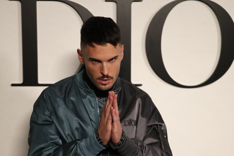 French model Baptiste Giabiconi poses before Dior's Spring-Summer 2021 fashion collection Tuesday, Sept. 29, 2020 before the show during the Paris fashion week. (AP Photo/Francois Mori)