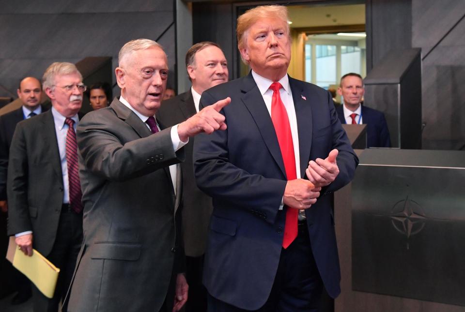 US President Donald Trump (C) walks with US Secretary of Defence James Mattis (3L), US Secretary of State Mike Pompeo (REAR) and US National Security Adviser National security adviser John Bolton (2L) after arriving to attend the North Atlantic Council meeting during the NATO (North Atlantic Treaty Organization) summit, at the NATO headquarters in Brussels, on July 11, 2018. (Photo by EMMANUEL DUNAND / AFP)        (Photo credit should read EMMANUEL DUNAND/AFP via Getty Images)