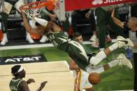 Milwaukee Bucks' Giannis Antetokounmpo dunks during the first half of Game 1 of the NBA Eastern Conference basketball finals game against the Atlanta Hawks Wednesday, June 23, 2021, in Milwaukee. (AP Photo/Morry Gash)